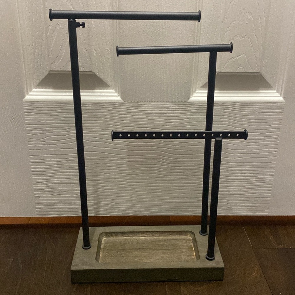 Jewelry holder including bracelets, necklaces, earrings, and rings.